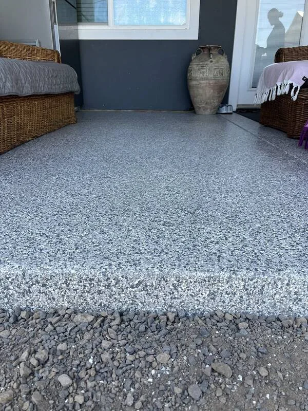 Finished UV-stable polyaspartic garage floor coating with decorative flake in Maui