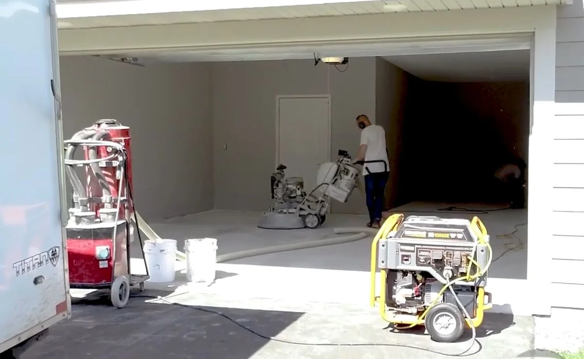 Diamond-grinding surface prep on a Maui garage floor before coating, a key factor in coating cost